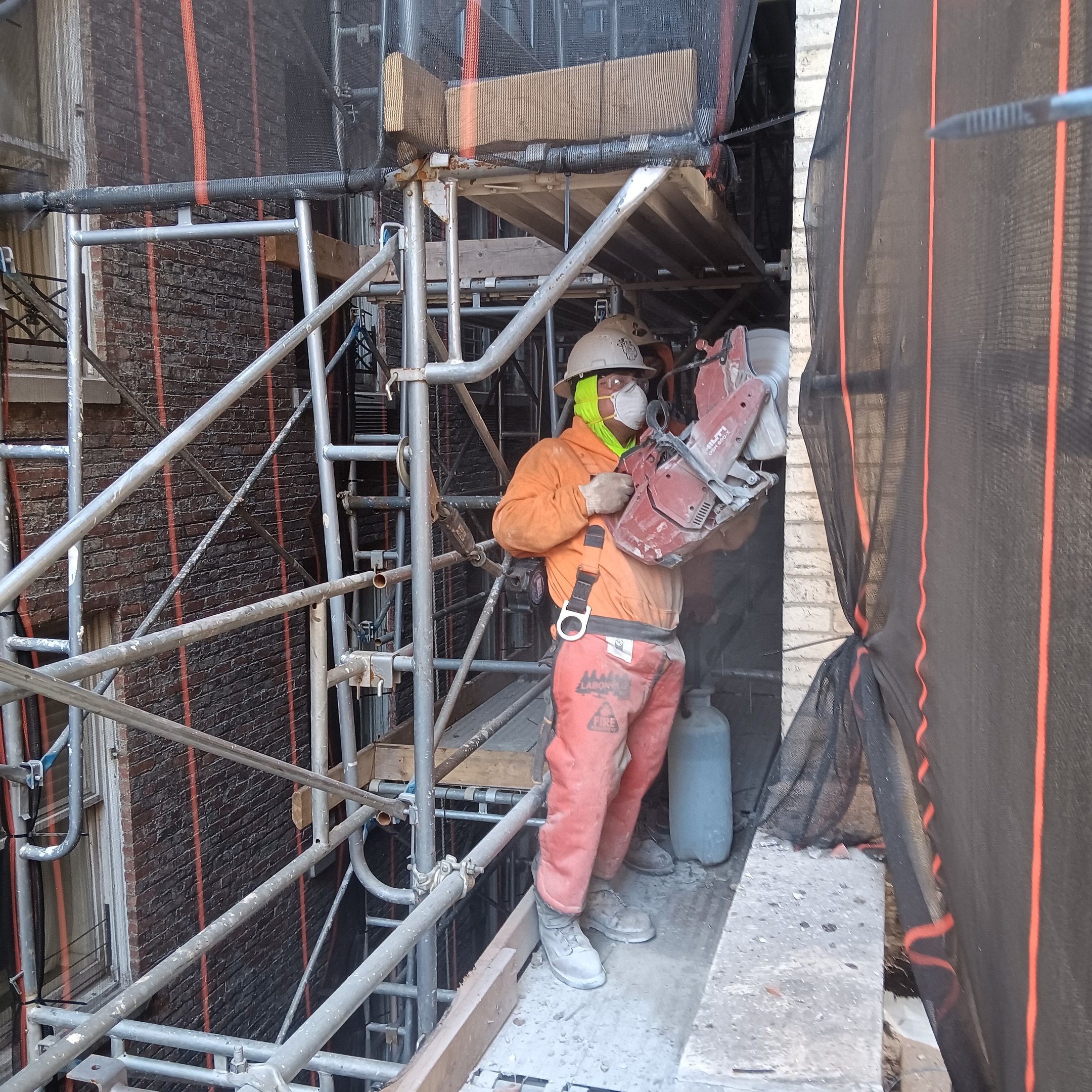 Andrew Horan with crew at clean demolition site in NYC, rebuilding Alba Services reputation through 