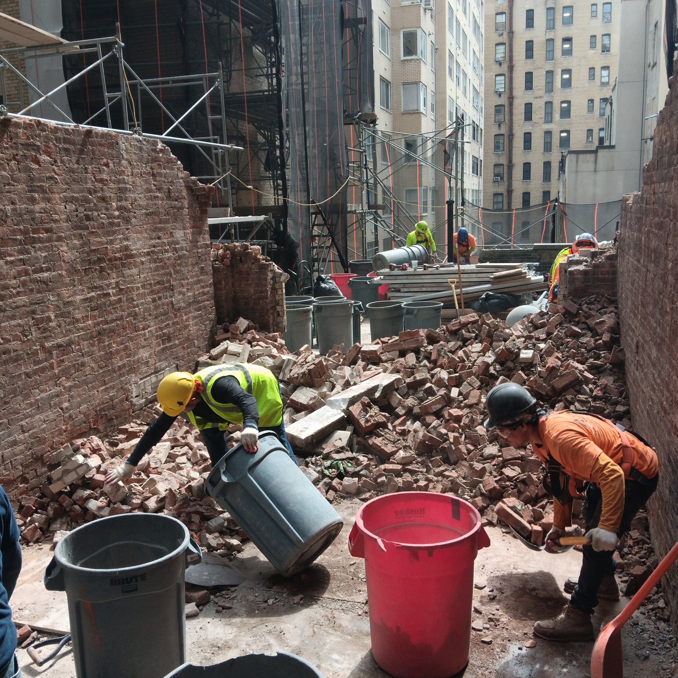 Andrew Horan overseeing clean demolition site in NYC, symbolizing leadership and trust at Alba Servi
